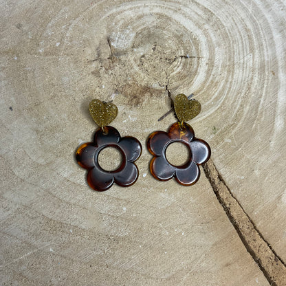 Les boucles d’oreilles marguerite